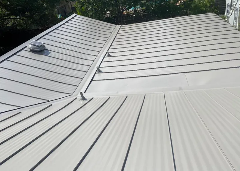 Solar attic fan installed on a metal roof for Roof Ventilation in Temple City